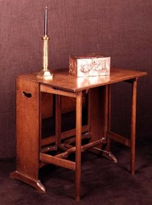 Arts and Crafts table, casket and candlestick, late 19th century by English School